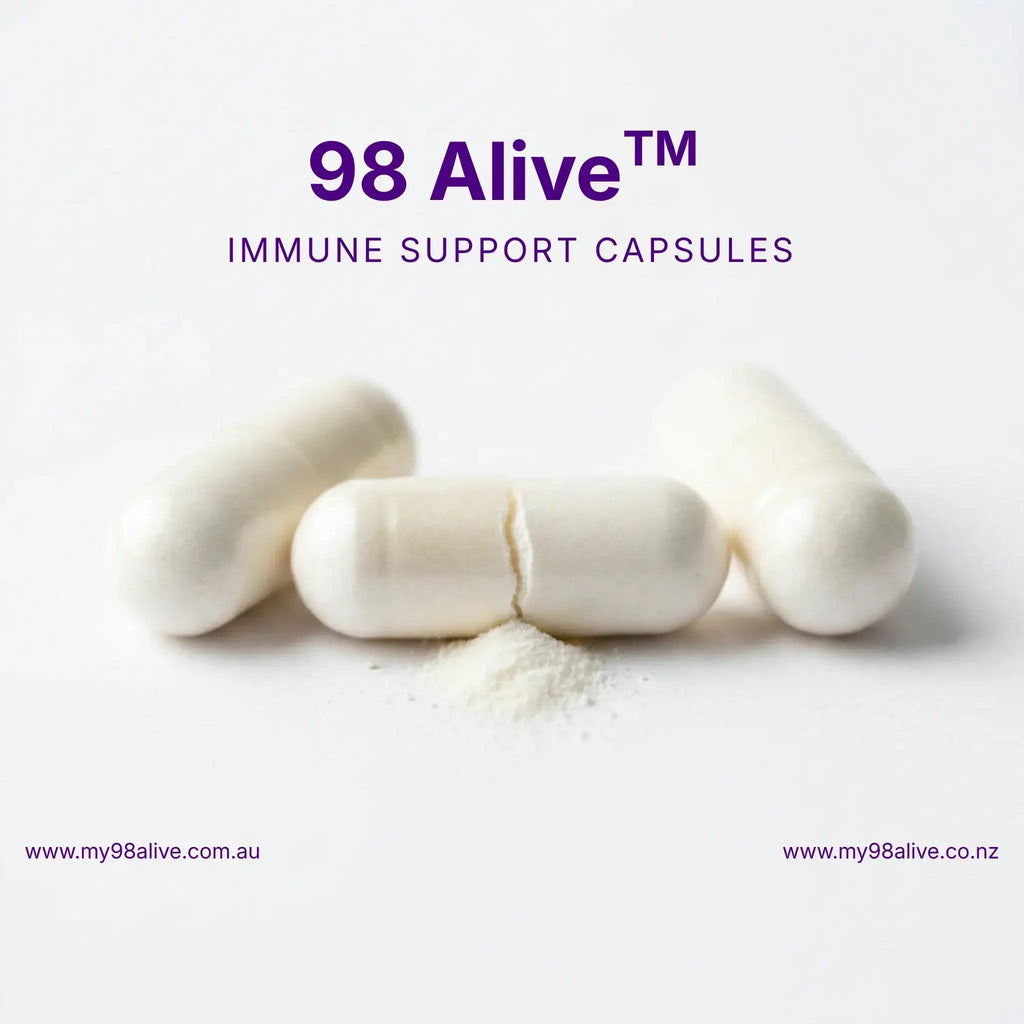98 Alive immune support capsules on a white background with visible powder.