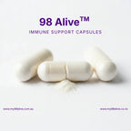 98 Alive immune support capsules on a white background with visible powder.
